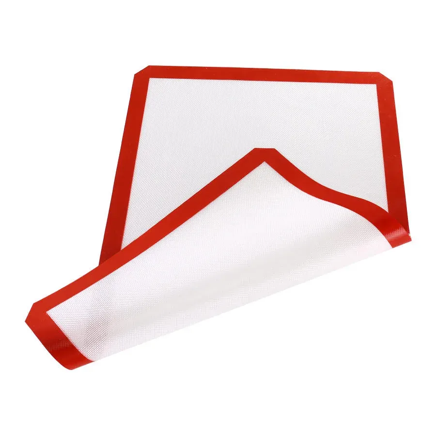 Flexible silicone baking mat rolled to show material and thickness
